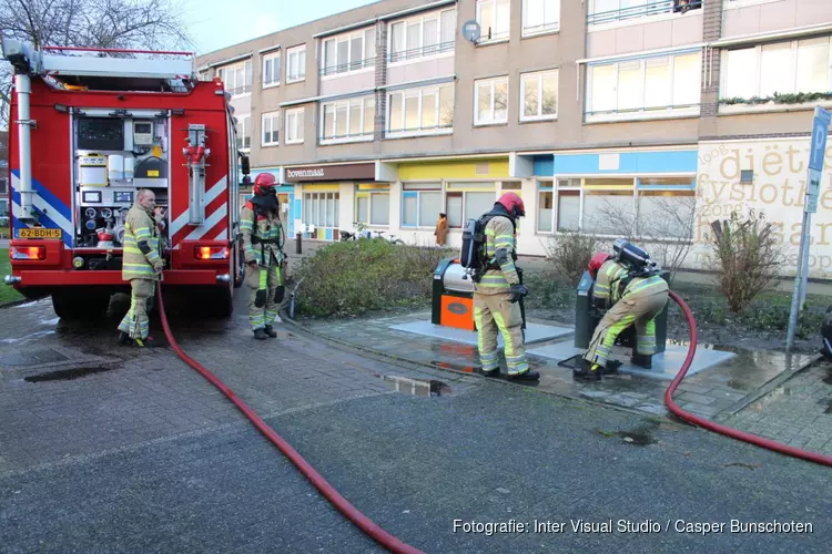 Brand in ondergrondse container aan de Wadden in Huizen